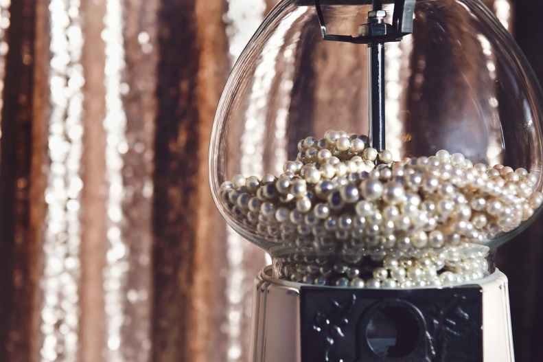 close up photography of clear glass candy dispenser